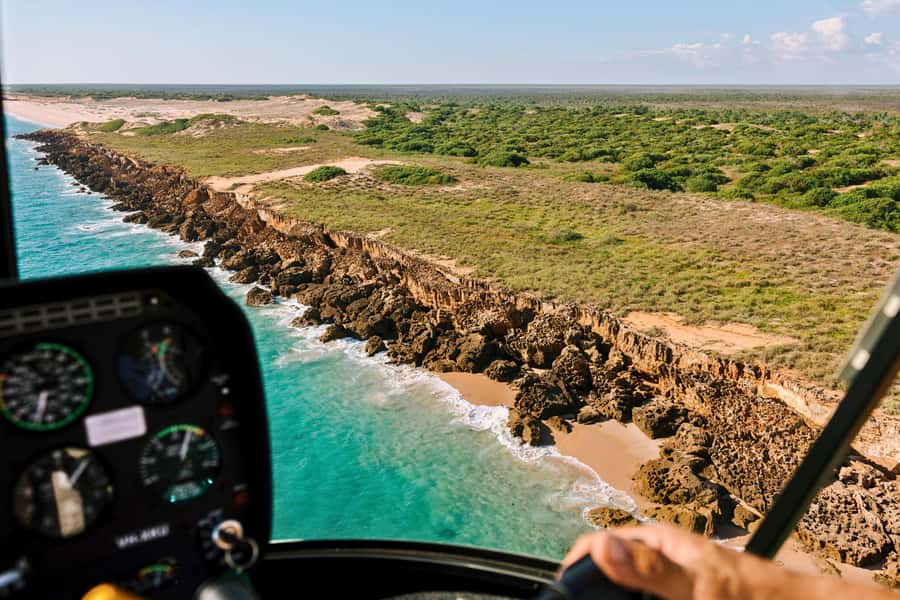 Broome: Cliffs & Coast 60 minute Scenic Helicopter Flight - Leaving Broome over Cable Beach