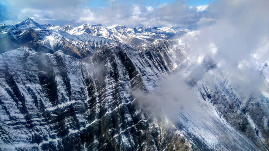 Canmore: 25-Minute Three Sisters Helicopter Tour - Through Three Sisters Pass into Spray Valley