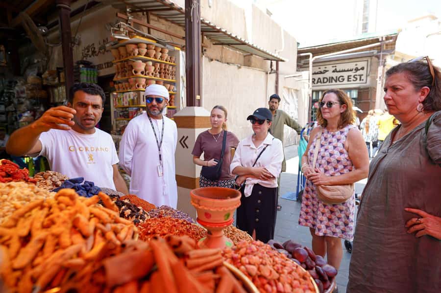 Dubai: Helicopter Ride, Old Town Walking Tour, Abra & Snacks - Walking through Al Fahidi and Al Seef
