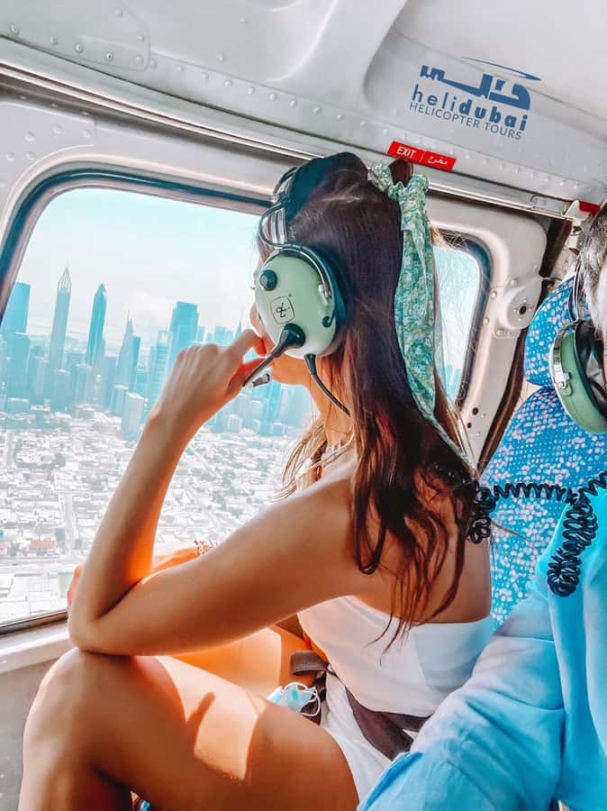 Dubai: Helicopter Ride, Old Town Walking Tour, Abra & Snacks - Guides, group size, and the feel of the day