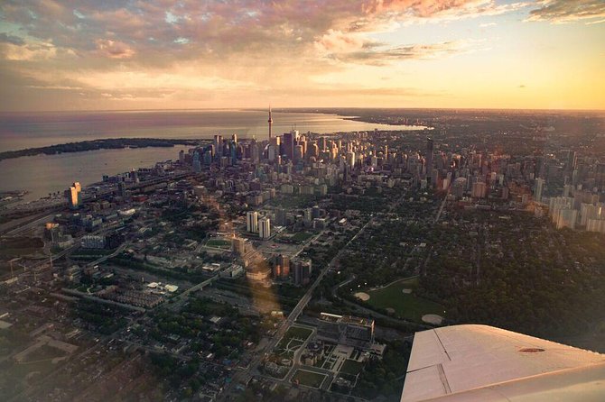 Exhilarating 120km Aerial Tour of Toronto with iflyTOTO - The CN Tower and Lake Ontario from Billy Bishop Airport