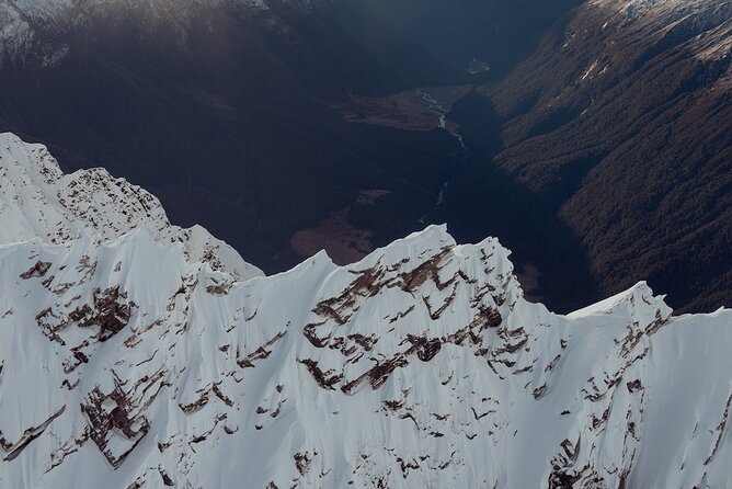 Glenorchy Snow Landing Helicopter Flight 30mins - Stepping into the snow