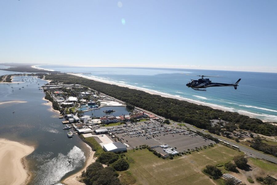 Gold Coast: Sea World and Broadwater Scenic Helicopter Tour - Crossing the coast and spotting Q1