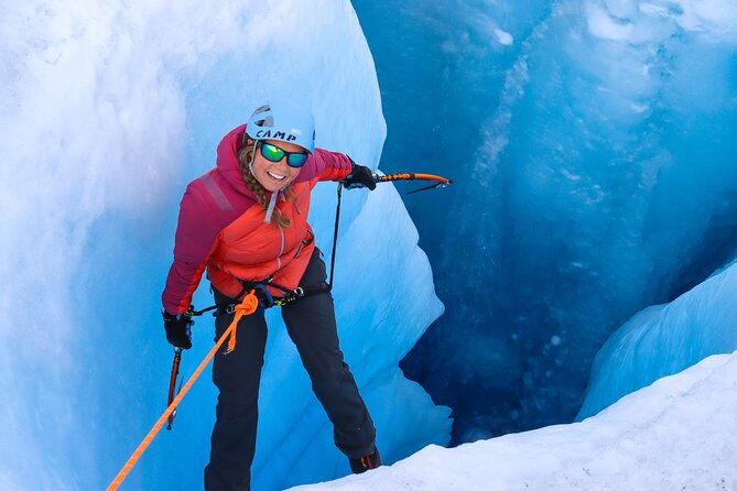 Heli Glacier Crevasse Ice Climbing- Summer - Descending into a glacier moulin