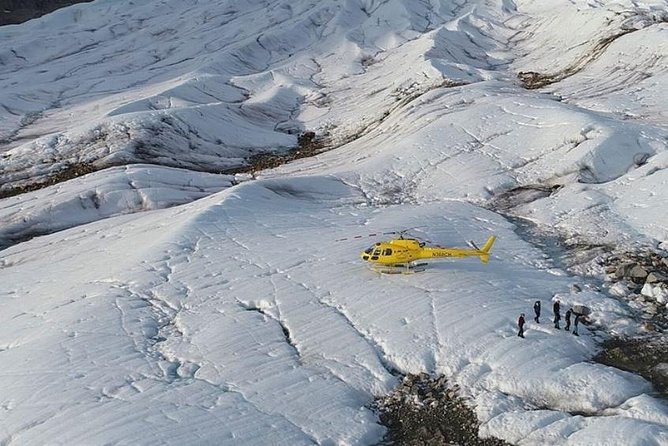Helicopter to a Dogsledding Experience with a Glacier Landing - Meeting the mushers and dogs at the glacier camp