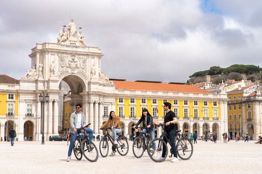 Lisbon: Guided Bike Tour, Helicopter Flight, and Boat Trip - Starting in Rossio Square and entering old Lisbon