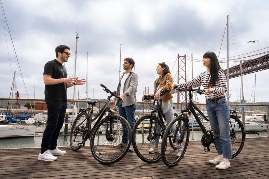 Lisbon: Guided Bike Tour, Helicopter Flight, and Boat Trip - Returning by boat along the Tagus