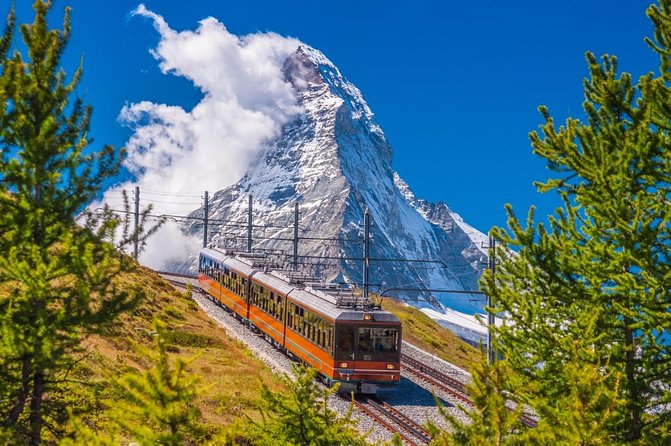 Matterhorn helicopter tour - longest scenic flight from Bern over the Swiss Alps - Oeschinensee, a turquoise lake among high peaks