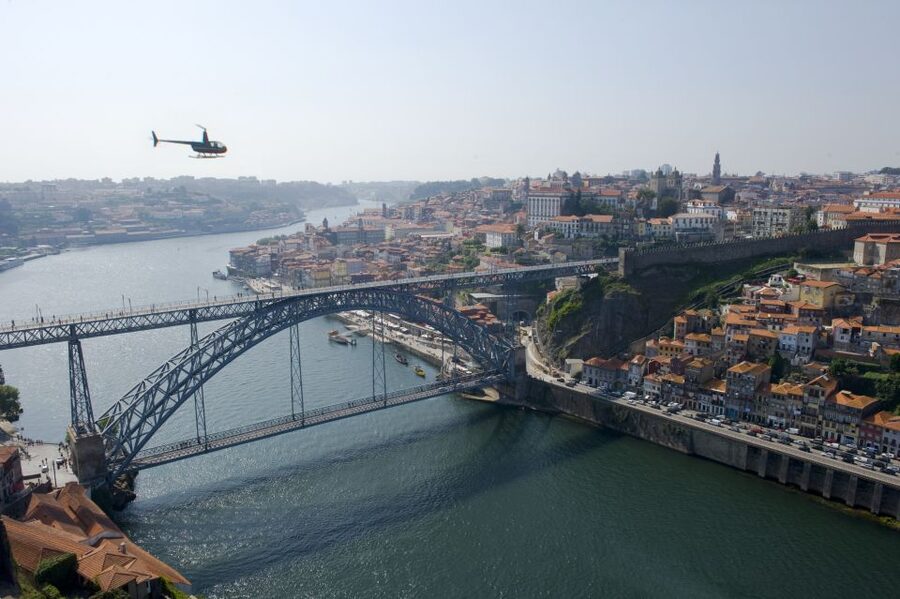 Porto: Douro River Helicopter Tour - Porto’s old town appears as a red-roofed hillside