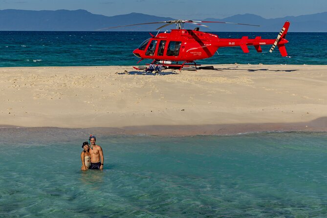 Private Helicopter Tour: Reef Island Snorkeling and Gourmet Picnic Lunch - Taking off from Cairns for a reef view from above