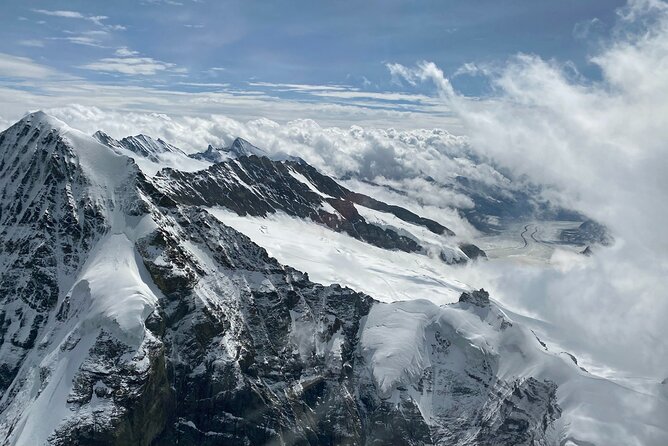 Private Swiss Alps helicopter tour over snow covered mountain peaks and glaciers - The Eiger’s north face up close