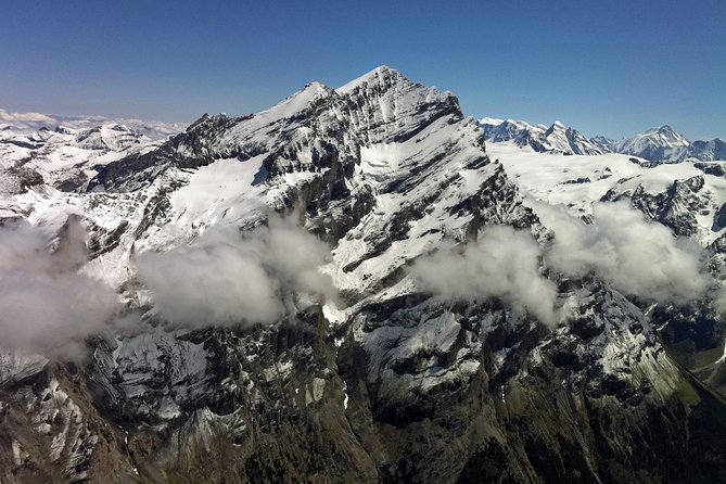 Private Swiss Alps helicopter tour over snow covered mountain peaks and glaciers - Interlaken between Lake Thun and Lake Brienz