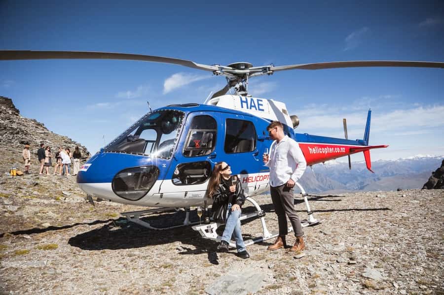 Queenstown: Helicopter & Wine Tasting Tour - The mountain landing with sparkling wine