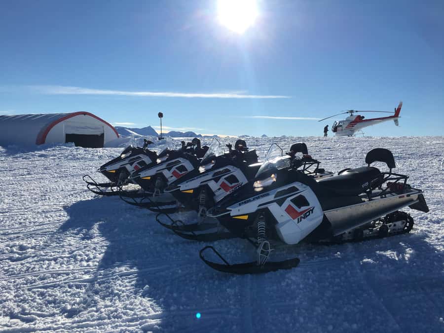 Queenstown: Snowmobiling Experience with Helicopter Flight - Riding through the Garvie Mountain Range