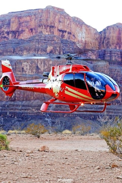 Vegas: Grand Canyon Airplane, Helicopter and Boat Tour - A pontoon boat below the rim