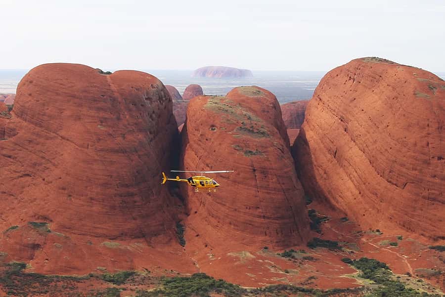 Yulara: Uluru and Kata Tjuta Sunset Helicopter Tour - Safety briefing and boarding at Ayers Rock Airport